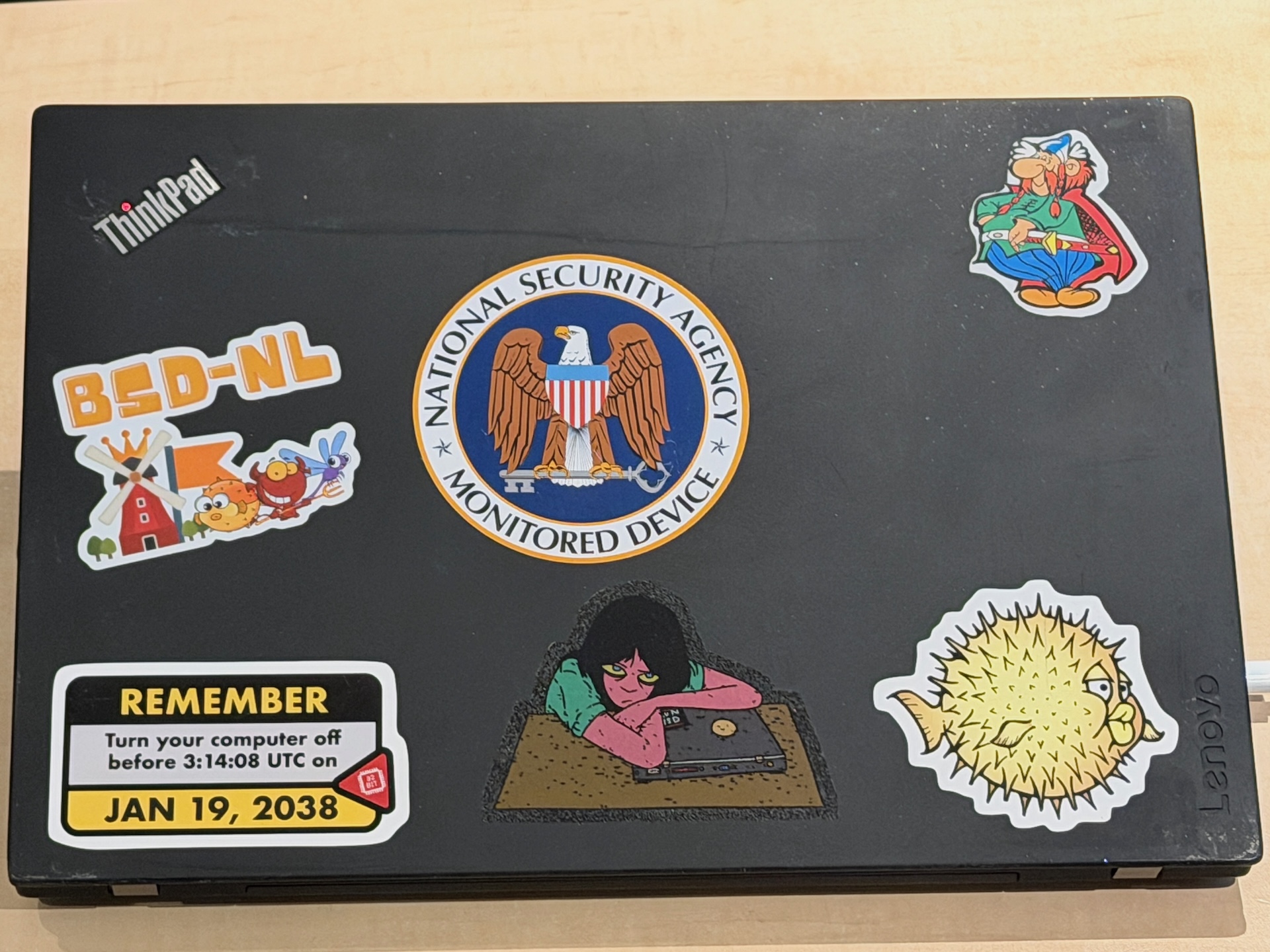 OpenBSD laptop Abraracourcix showing all its stickers